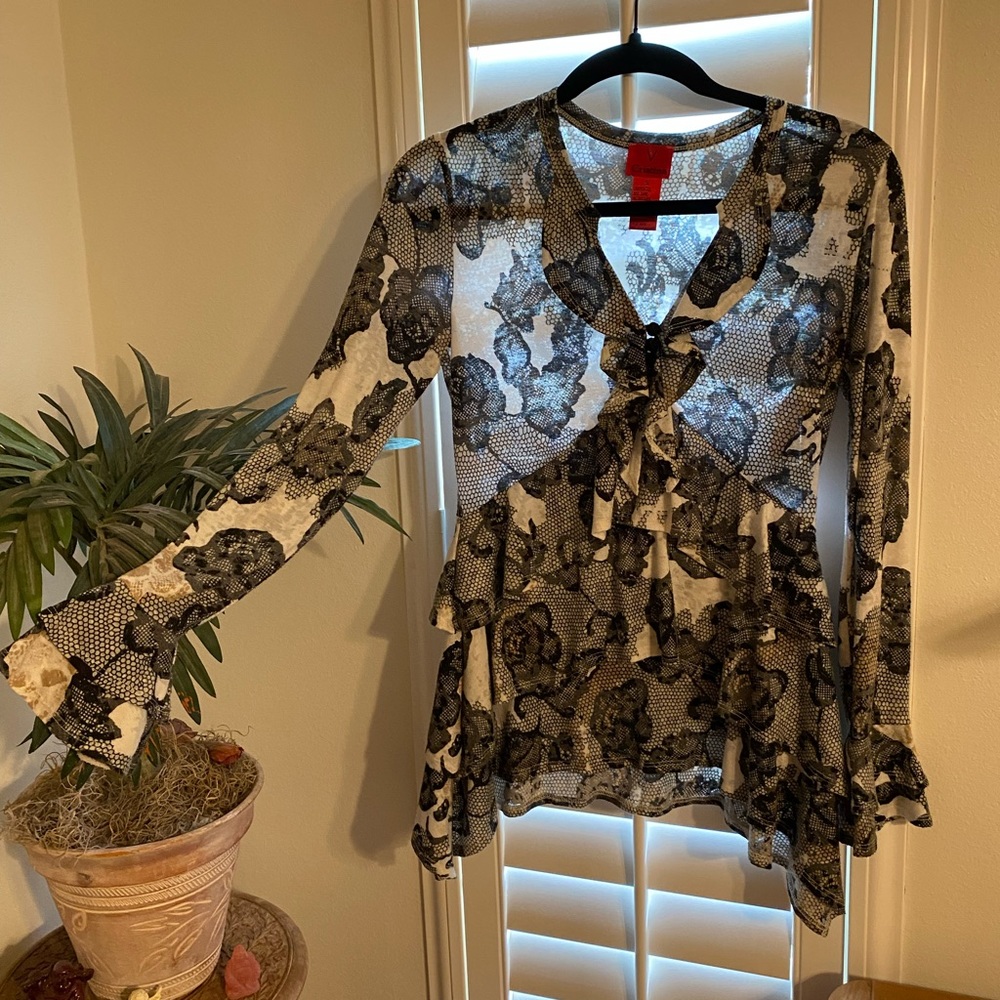 Small ruffled blouse with black and white flowers